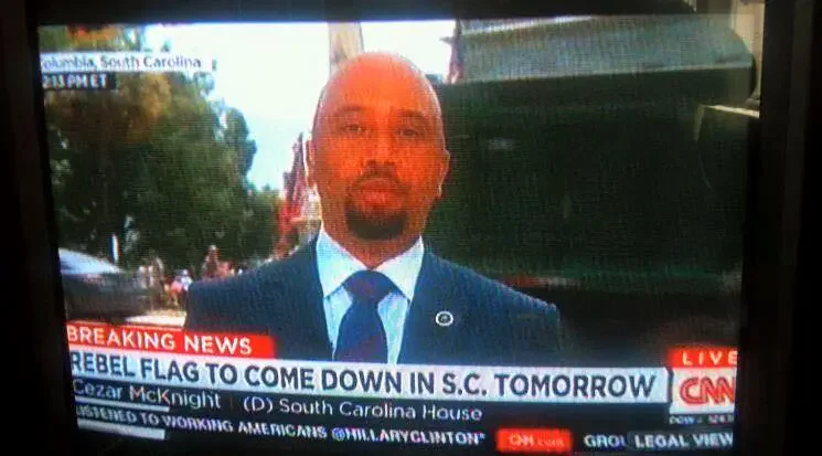 CNN reports on the rebel flag removal in South Carolina, featuring Cezar McKnight.
