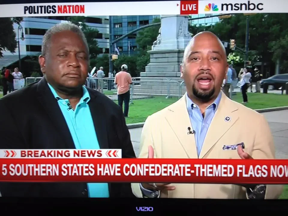 Cezar McKnight speaks on a news program about Confederate flags.
